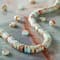 12 Pack: Blue & Brown Serpentinite Jasper Heishi Beads by Bead Landing™